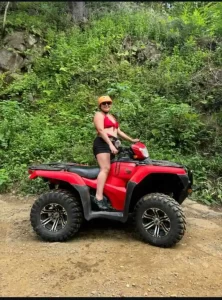 women standing on ATV Quad Bike.