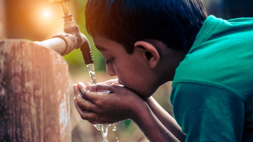 Boy Drinking Tap water